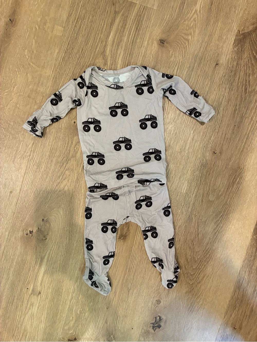 Neutral Gray Baby footed two-Piece with Black monster Truck Print